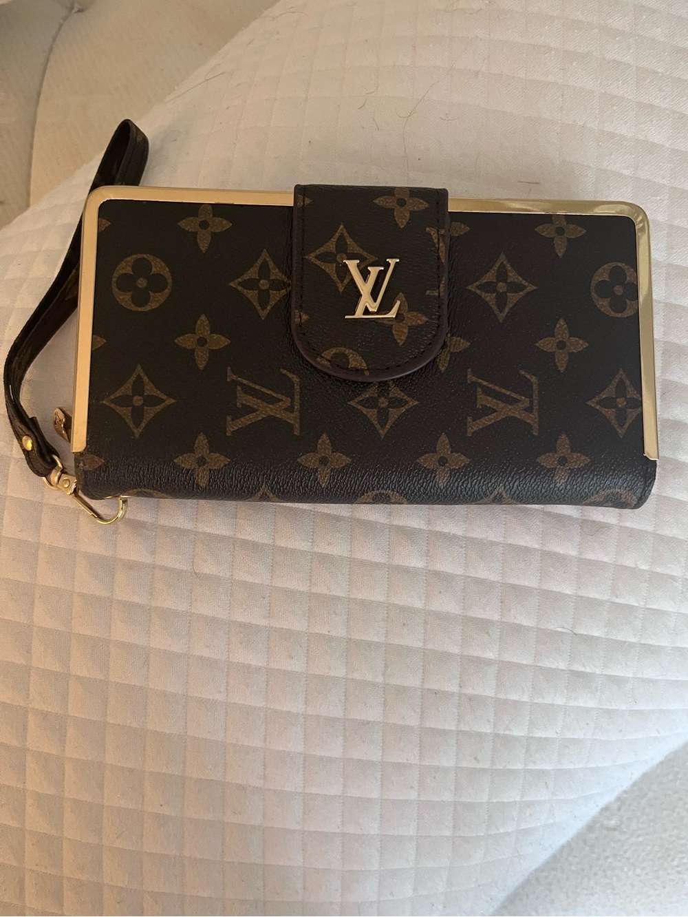 Super Nice wristlet wallet adorned with worlds most famous brown pattern